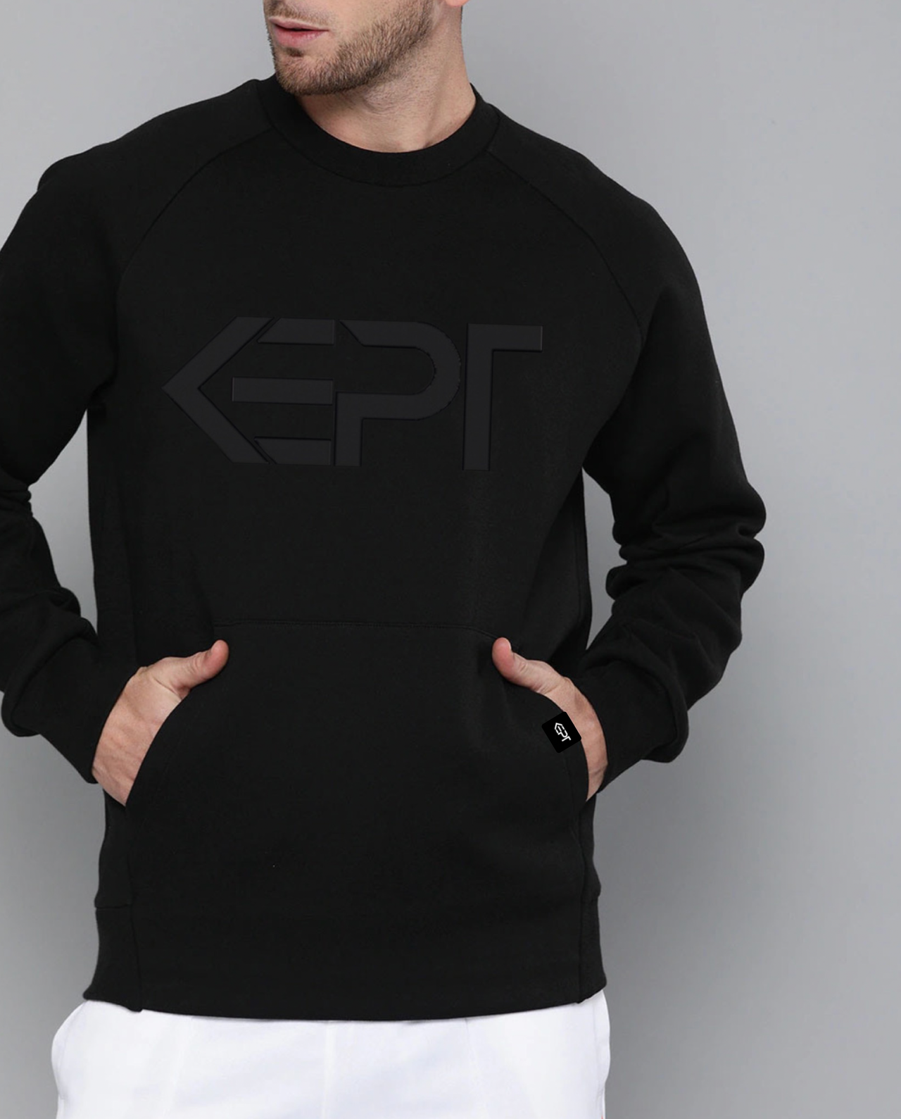 A man wearing a black sweatshirt made by KEPT.